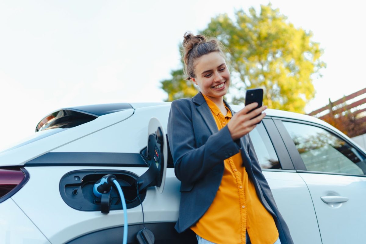 woman charging her electric vehicle