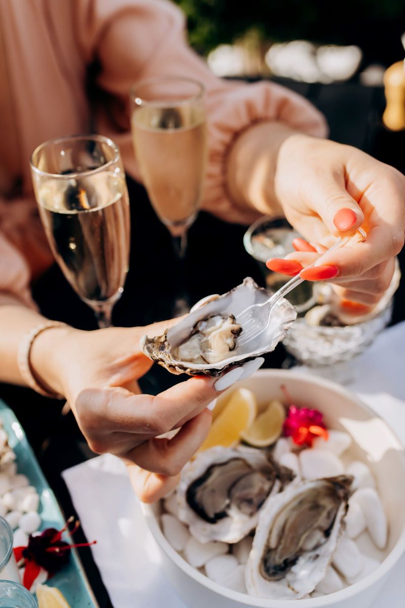 woman eating fresh oysters